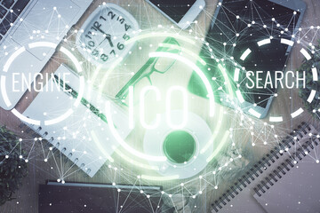 Double exposure of blockchain theme hologram over table with phone. Top view. Crypto technology concept.