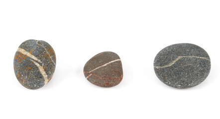Obraz na płótnie Canvas Grey pebbles isolated on white background. Grey sea stones with white stripes isolated on white. Studio shot.