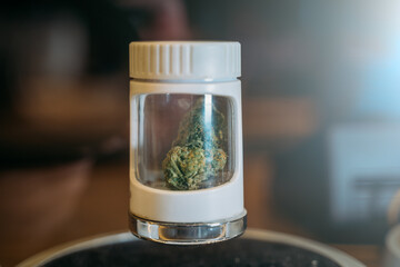 Hemp or cannabis in white tube in Coffee Shop in Amsterdam, close up.