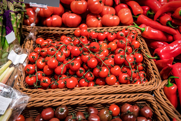 ripe cherry tomato twigs in the supermarket