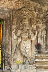 A Beautiful stone sculpture of an Hindu god adorns the wall of an ancient temple in Talakadu town near Mysuru in Karnataka,India.