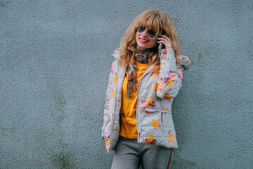 adult woman with mobile phone on the street