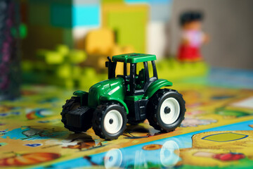 toy model of a tractor of green color