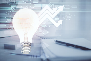 Double exposure of bulb drawing and desktop with coffee and items on table background. Concept of ideas.