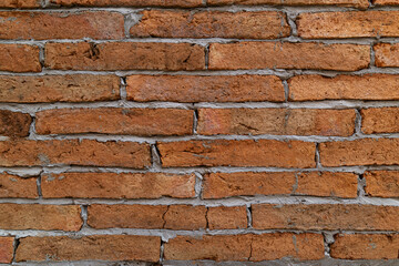 Brick wall with red brick background.