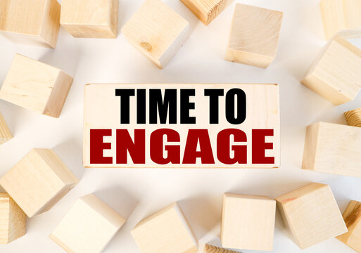 Time To Engage. Text On A Piece Of Wood. On A White Background