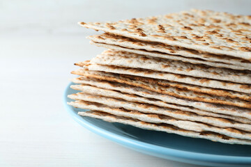 Stack of matzos on white table, closeup