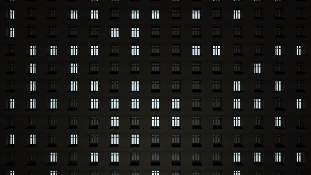 In a huge house at dusk the windows blink very quickly. The house is signaling something.