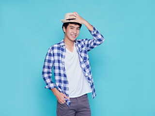 Handsome man posing on blue background