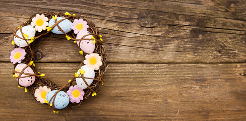 Easter wreath on an old wooden background