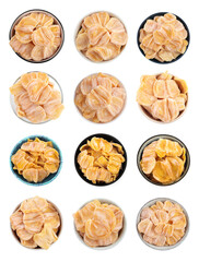 Set with sweet dried jackfruit slices in bowls on white background, top view