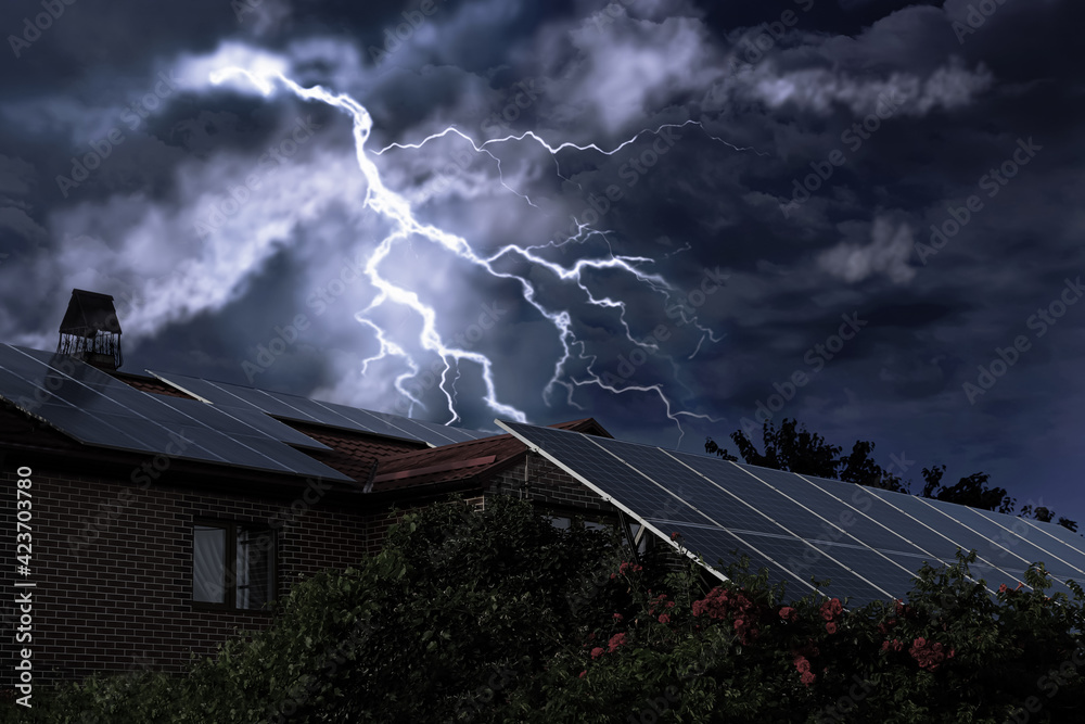 Wall mural dark cloudy sky with lightning over house. stormy weather