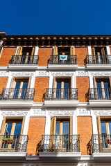 Fototapeta na wymiar Old luxury residential buildings with balconies in historic centre of Madrid. Concept rent regulation and real estate