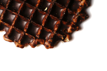 Delicious Brussels waffle in chocolate on a white plate with space for text. Top view. Closeup