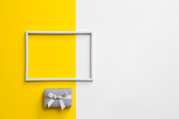 Empty photo frame for text on geometric paper white and yellow colorful background.