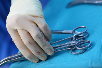 Surgical instruments in the hand of the medical staff during the operation
