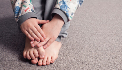 Child's bare feet. Hands. Heel and foot. Toes and toes
