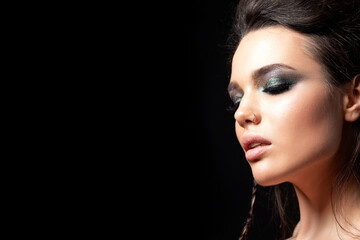Portrait of beautiful woman with evening make u