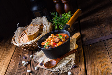 Delicious bean stew with sausage and potato