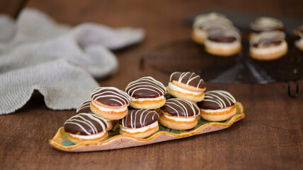 Boucher cakes with chocolate icing on a beautiful plate.