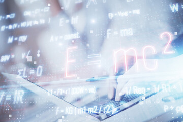 Double exposure of woman hands typing on computer and formula hologram drawing. Education concept.