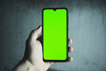 Smartphone with greenscreen.  Mobile phone frameless design concept template.