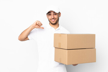 Delivery Arabian man isolated on blue background proud and self-satisfied