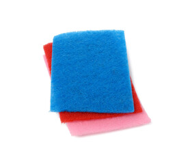 stack of new multi-colored kitchen sponges for washing dishes on a white background