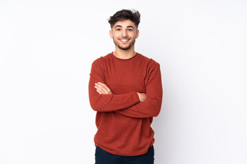 Arabian handsome man over isolated background keeping the arms crossed in frontal position