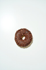 Favourite dessert. Delicious chocolate donut with sprinkles on white background
