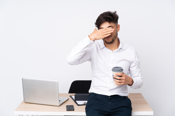 Arabian man in a office isolated on white background covering eyes by hands. Do not want to see something