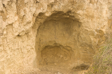 Big  hole  in sandy hill in an open pit in Ukraine