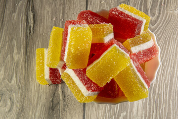 Dish with wonderful layered fruity marmalade closeup.