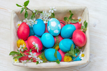 Colorful Easter eggs on wooden background