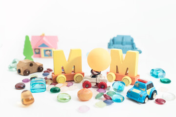Obraz premium Mother's day message of multicolored puzzle pieces. Happy mother's day concept background.