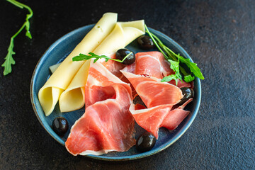 jamon Dry meat Italian Prosciutto Serrano, Bellota, Crudo or Parma ham portion on the table meal top view copy space for text healthy food background rustic