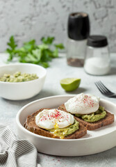 toast with guacomole and poached egg