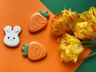 White Easter bunny gingerbread with orange tulips 
