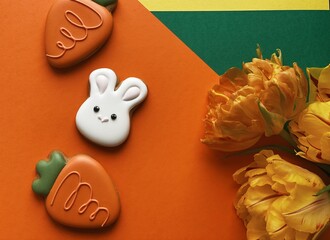 White Easter bunny gingerbread with orange tulips 