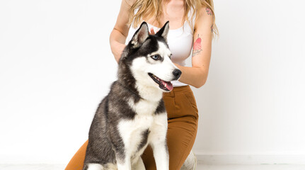 Young woman with her husky dog