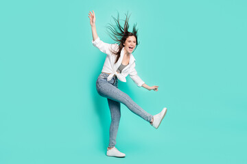Fototapeta na wymiar Full body profile side photo of charming pretty funky young woman dance fly hair wind isolated on teal color background