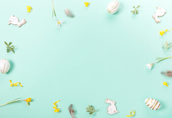 Festive Easter border, frame from easter eggs and spring flower crocus on blue background...Stylish easter flat lay blue, great design for any purposes.
