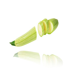 Fresh ripe organic vegetable marrow cut into several slices isolated on white floats freely in the air. Concept of fresh vegetables, diet, food levitation.