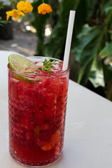 Mixed Berries Soda topped with a slice of Lemon