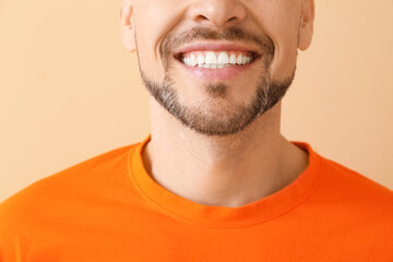 Smiling man on color background