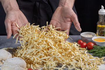 Step by step instructions for making homemade noodles. The cook is cutting the dough. Wooden background.