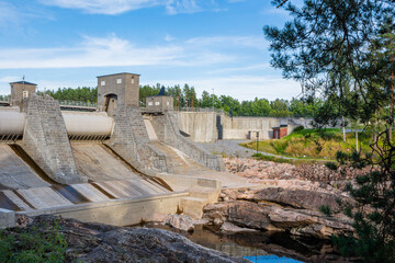 Fototapeta na wymiar View of the hydroelectric powerplant dam and The Imatrankoski rapid (The Imatra Rapid) in summer, Vuoksi River, Imatra, Finland