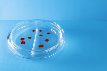 Medecine. A gloved hand holds a test tube containing the virus. Elements of a bitmap drawing. The...