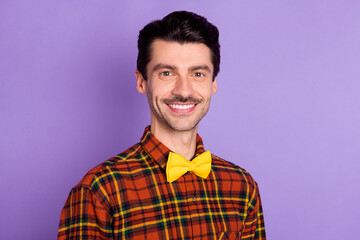 Photo of nice attractive young man dressed checkered shirt smiling isolated purple color background