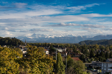 Fototapeta na wymiar French town Pau against the winter Pyrenees mountains peaks